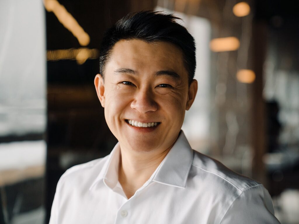 Man smiling in office space