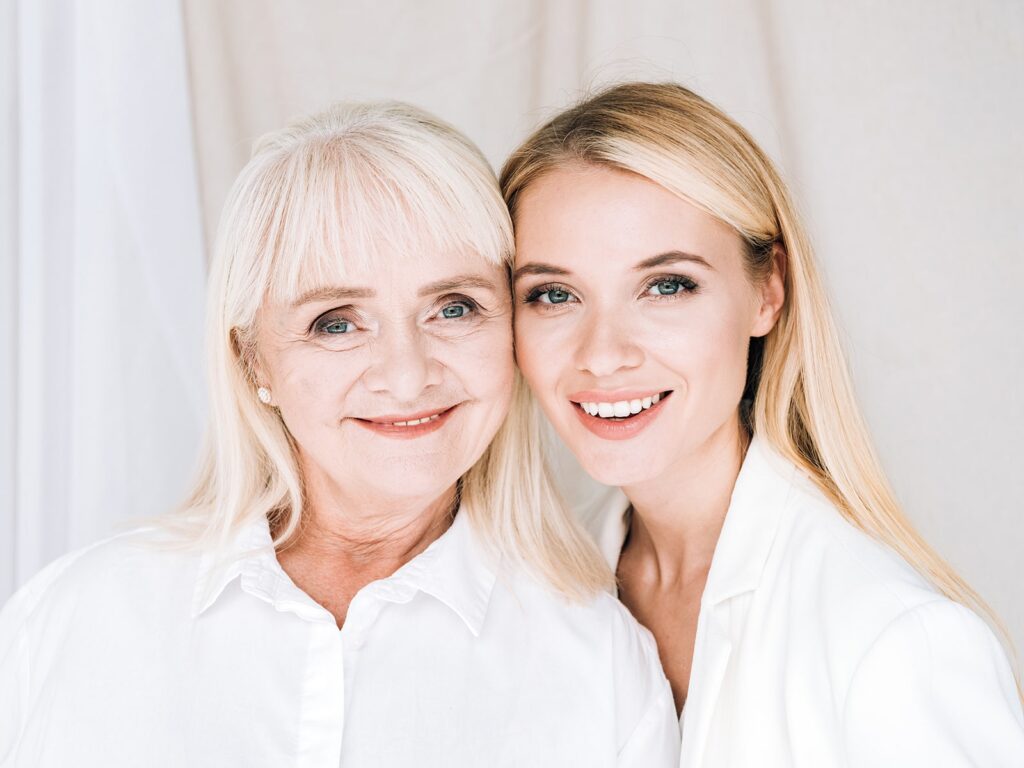 Mother and daughter smiling